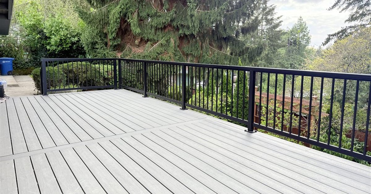 Gray composite deck with black aluminum railing in Portland, a typical Trex vs TimberTech decision for PNW homeowners